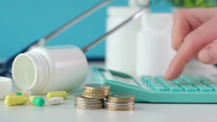 Doctor with calculator calculating costs and income in medical practice and hospital. Cost of health insurance - Powered by Adobe