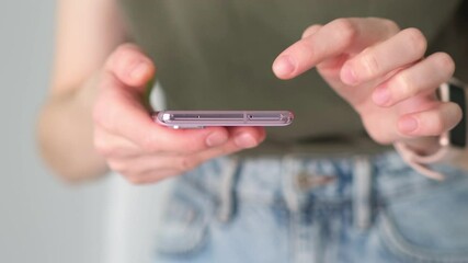 Closeup shot of business woman reading message or downloading an app on mobile phone, browse social network.Online life in cell phone device on internet - Powered by Adobe