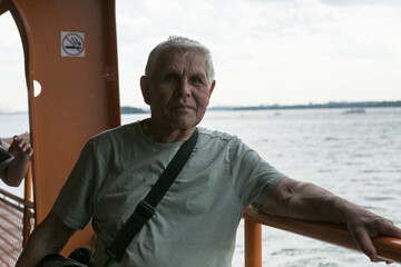 Active Senior Man Traveling  in New York City.  A 75-year-old man explores the streets of New York City, embracing adventure and independence in his golden years.