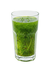 A glass of liquid with floating green herbs and red specks sits against a black background