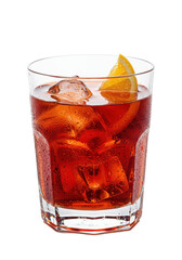 Dark red cocktail with ice, garnished with an orange peel, sitting in a clear glass, on dark surface