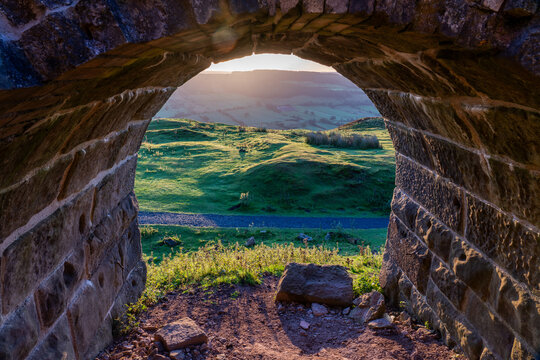 Looking through a stone archway of the rosedale kilns reveals a verdant rolling landscape