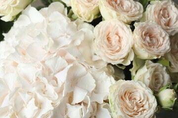 Beautiful bouquet with peony roses and white hydrangea in the vase on the table