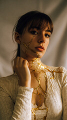 Woman with Gold Leaf on Face and Chest