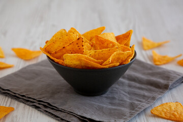 Crunchy Nacho BBQ Tortilla Chips in a Bowl, side view. Close-up.