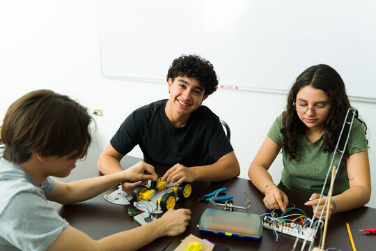High school students building robot in science class