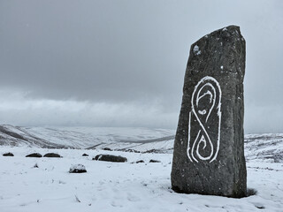 Ancient Stone Carving in Snowy Landscape A Winter Scene