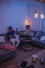 Relaxed Couple Enjoying Wine at Home in the Evening