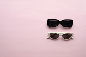 Sunglasses on a plain background. Summer, chamomile