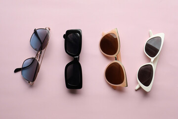 Sunglasses on a plain background. Summer, chamomile