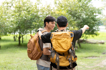 Father and Son Hiking Together. A father guiding his son during an outdoor adventure.