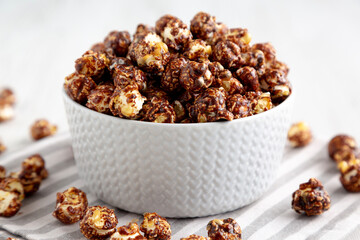 Homemade Chocolate Caramel Popcorn Ready to Eat in a Bowl, side view.