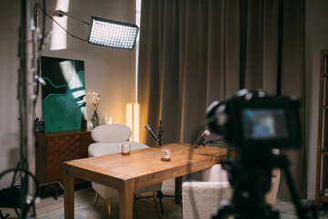 The interior of a recording studio is equipped with professional filming equipment for recording...