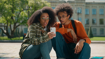African American couple man woman friends students male female girl guy together in city outdoors...