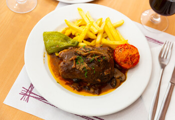 Liver meat with mushrooms, french fries and stewed vegetables