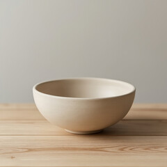 Empty Ceramic Bowl on Wooden Table with Neutral Background Representing Simplicity and Minimalism