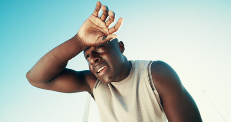 Fitness, tired and black man wipe sweat outdoor for health, wellness and exhausted on break....