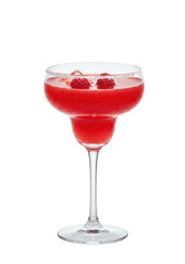 A stemmed glass filled with pink liquid and two raspberries as garnish on a black background