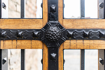 Selective focus, texture of a metal old lattice fence against the blue sky, fence lattice, lattice...