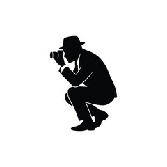 Silhouette of Photographer Squatting with Camera