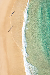 Crystal clear turquoise water transitioning into gentle waves.