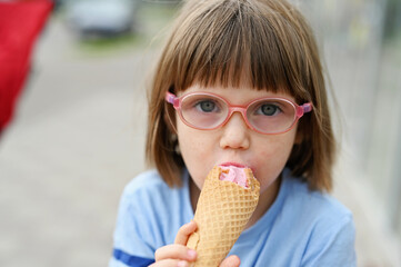 Little kid girl with ice-cream