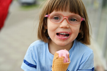 Little kid girl with ice-cream
