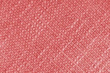 Close up, macro of red woven fabric with detailed texture and diagonal pattern. Textile, cloth,...