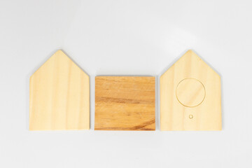 Wooden House Shape Parts with Square Centerpiece on White Background