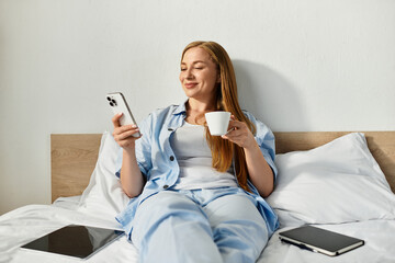 Cozy moments at home with a beautiful woman enjoying a warm drink and browsing on her phone