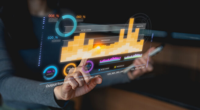 A person interacts with a transparent digital interface displaying colorful data charts and graphs, symbolizing futuristic data analysis and technology. - Powered by Adobe
