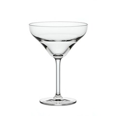 A clear coupe glass elegantly stands on a white backdrop, ready to be filled with a delicious cocktail or celebratory drink.