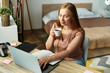 Young woman enjoys a cozy coffee moment at home while working on her laptop