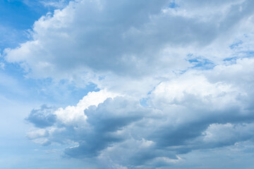 Obraz premium Dramatic Cumulus Cloudscape Blue Sky with Fluffy White and Gray Clouds