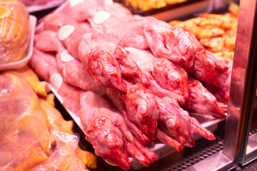 Raw rabbit carcasses on store shelf