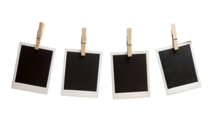 Four Blank Instant Photo Frames Hanging on a Rope Isolated on White Background


