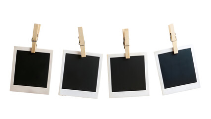 Four Blank Instant Photo Frames Hanging on a Rope Isolated on White Background

