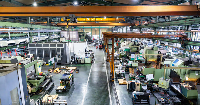 Aerial view of the inside of a factory with rows of machine tools