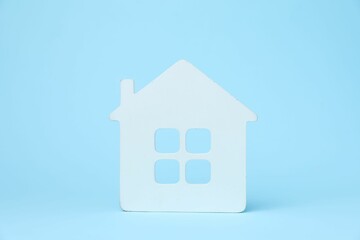 One white house model on light blue background