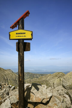 Yellow hiking sign indicating the altitude of 2178 meters above sea level on the summit of ban&iacute;kov in slovakia