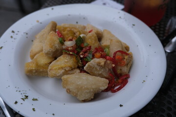 Tahu Cabai Garam is a popular Indonesian dish made of crispy fried tofu tossed with chopped chili, garlic, and salt.