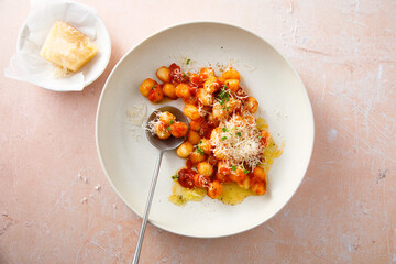 Potato gnocchi with tomato and cheese