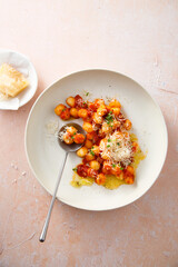 Potato gnocchi with tomato and cheese