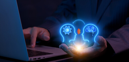 Businessman shows AI artificial intelligence icon on virtual screen. Machine learning concept, big data, innovation technology, cloud computing, futuristic, internet network communication.