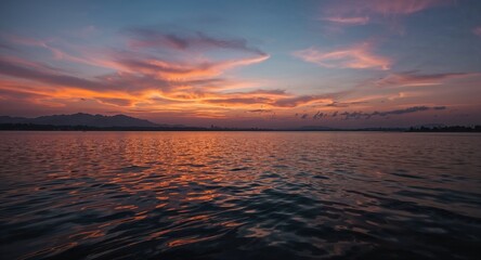 A soft focus image of several light pink peonies in full bloom with a creamy background hue
