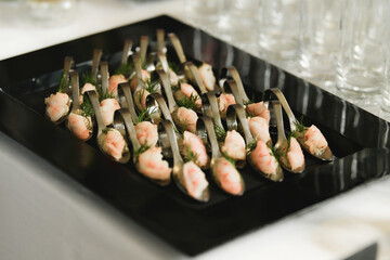 Shrimps with dill. Small canapes at a wedding