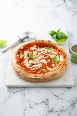 Traditional pepperoni pizza with fresh basil
