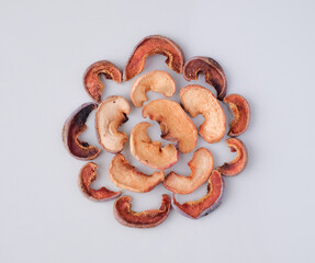 Several pieces of dry fruits on a white background. Healthy preserves dried fruits. A pile of dried fruit. Top view. Composition of pieces