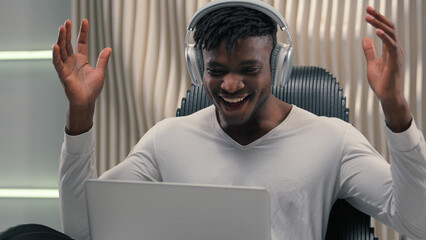 African American ethnic cyber man in white futurism studio indoors business male user gamer hacker...