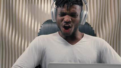 African American ethnic cyber man in white futurism studio indoors business male user gamer hacker...